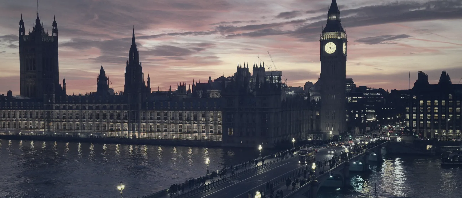 Westminster bridge and the clock tower in London at dusk
